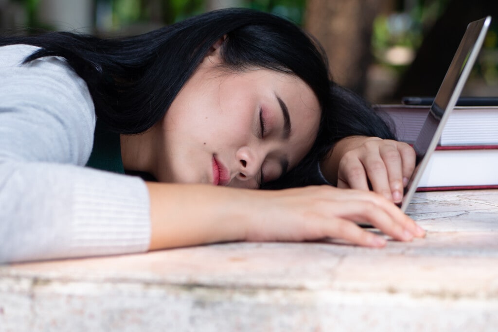 e learning, tired and sleepy asian female college student working hard with laptop, excessive education effort concept