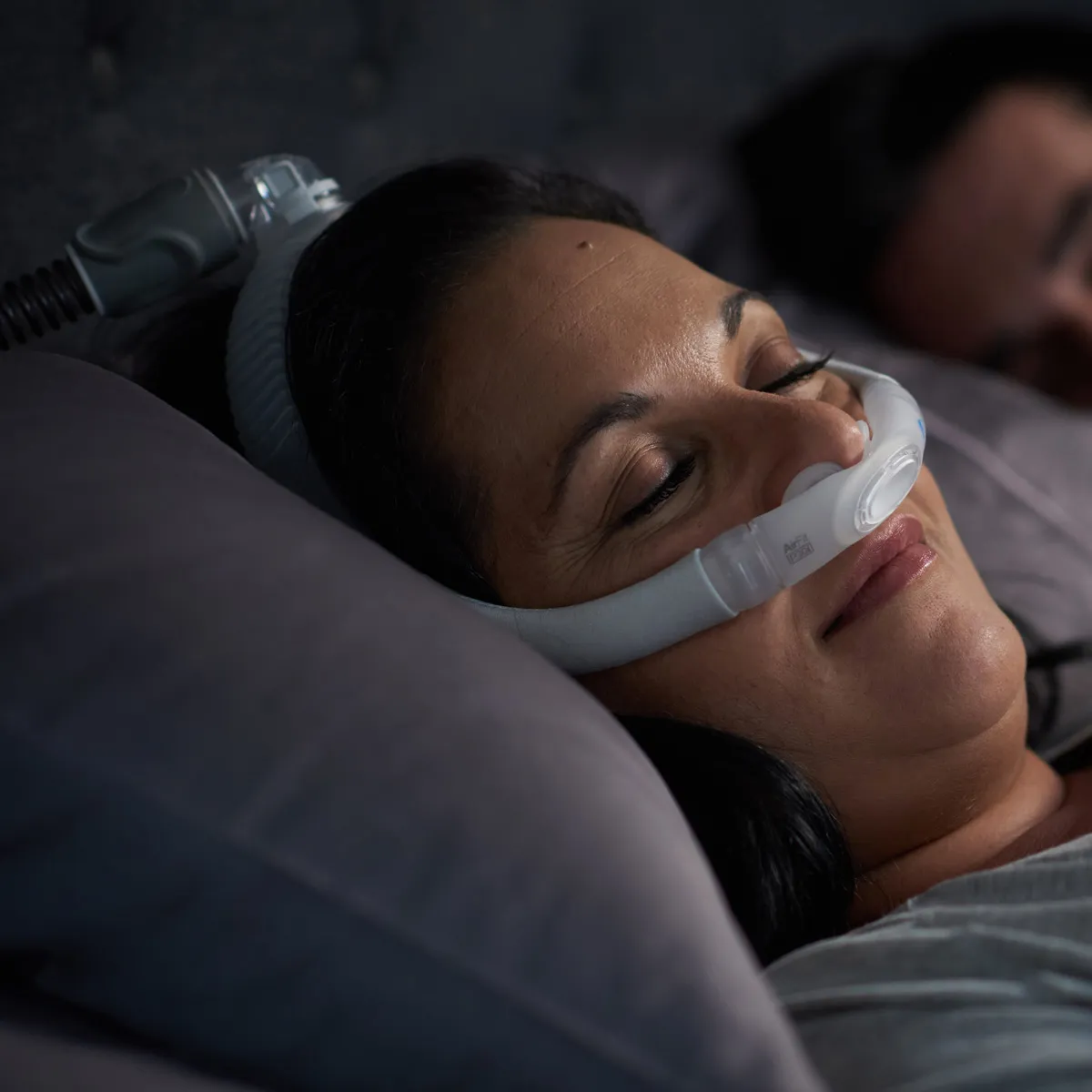 airfit p30i nasal pillows mask woman sleeping lifestyle.webp